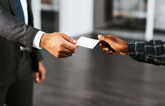 Attorney handing a business card to client attorney business cards