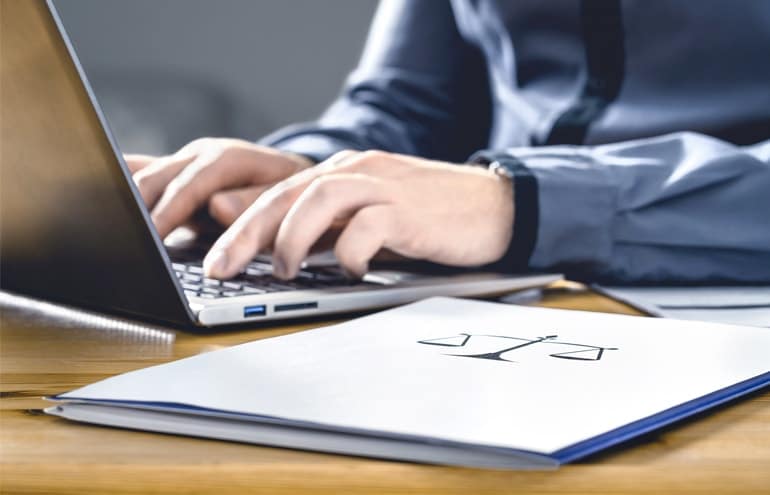 Assistant on laptop working legal assistants