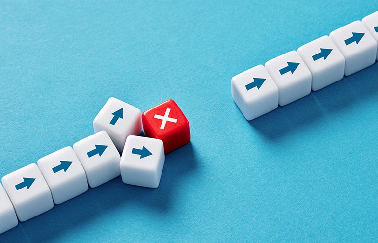 Illustration of dice representing overcoming client inertia and status quo bias in law firm business development