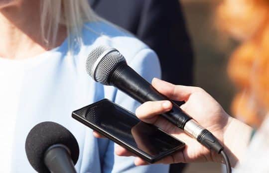 Women with mic PR for Your Law Firm