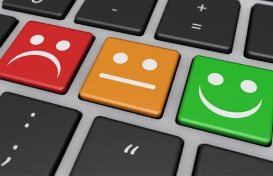 Keyboard with happy and sad faces Client Testimonials