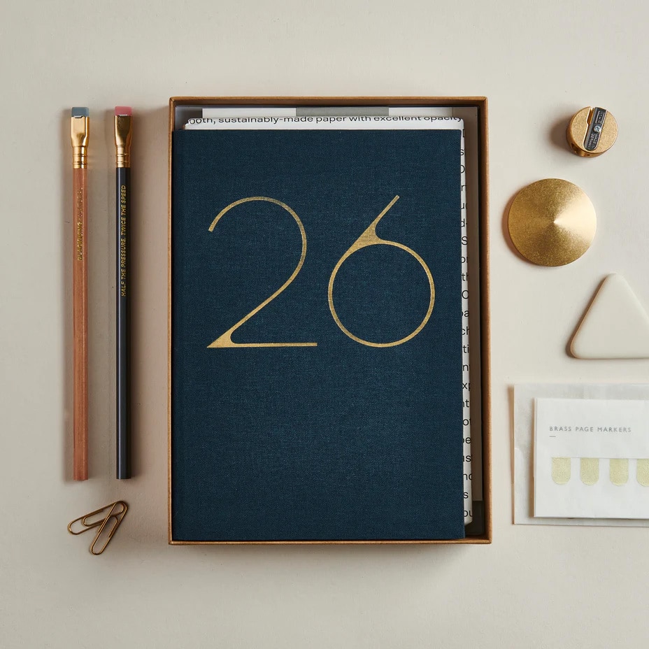 Mark & Fold luxury gift box containing a lay-flat journal, planner, and brass accessories.