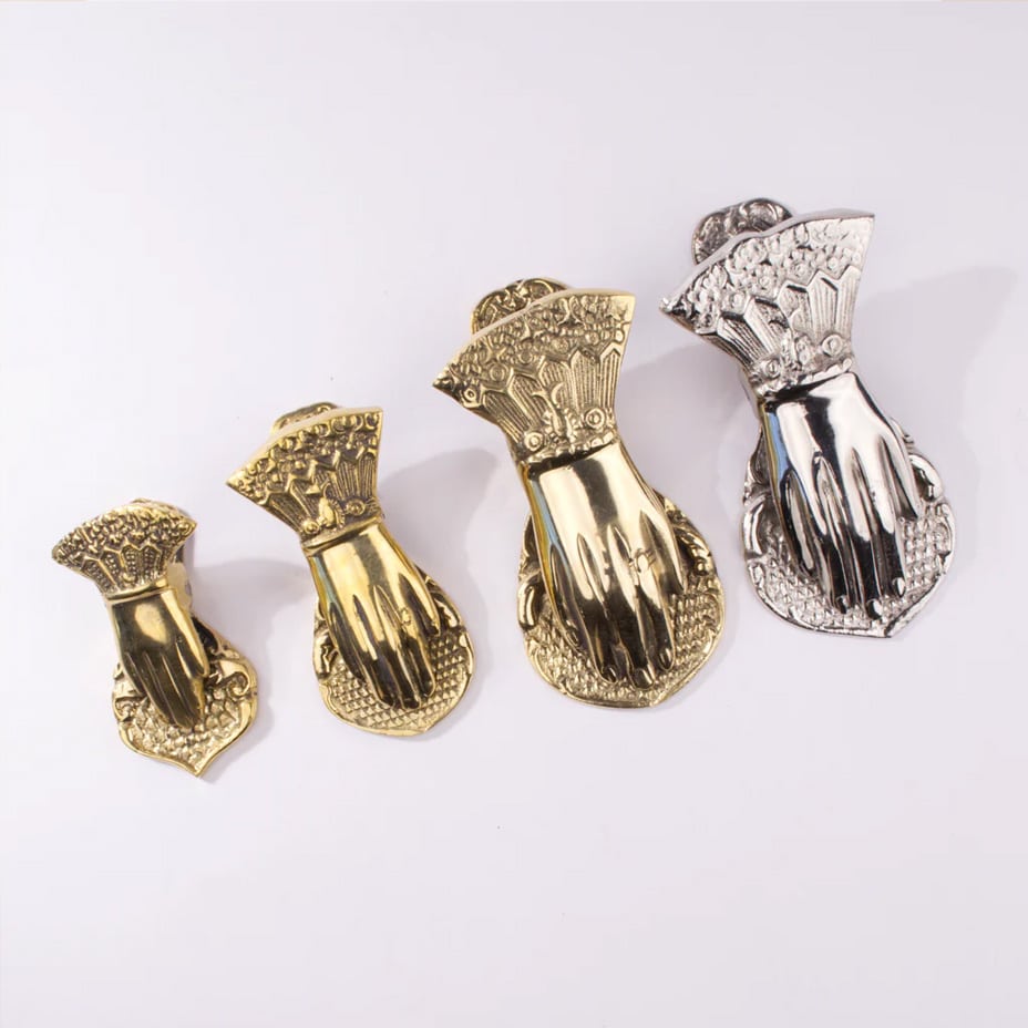 Victorian-style brass hand paper clips, a unique filing and desk accessory.