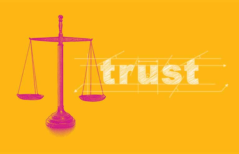 Yellow background with trust writen next to the scales of justice.