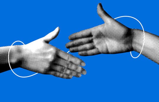 Two hands reaching for a handshake to symbolize trust in law firm lateral partners.