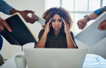 lawyer burnout and chronic responsibility woman lawyer at desk