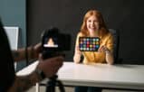 Female attorney smiling in a professional office for law firm video marketing.