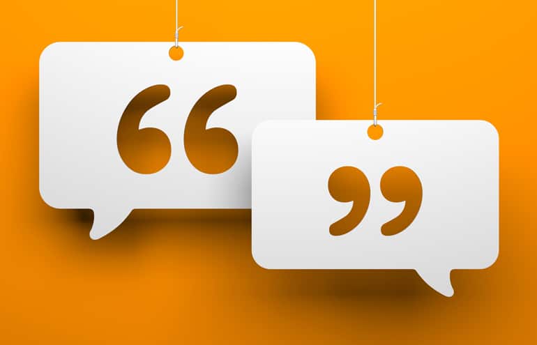 Two hanging quotation marks speech bubbles on an orange background representing cross generational communication in law firms