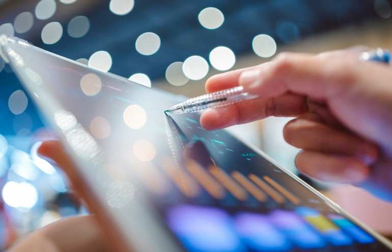 lawyer working with ipad on trust account reconciliation