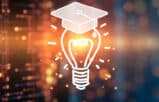 light bulb with a college graduation cap representing AI training for lawyers