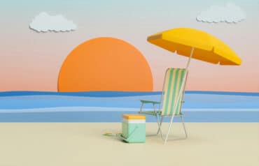beach scene with setting sun, chair and umbrella on the sand - how to find time for fun as a lawyer