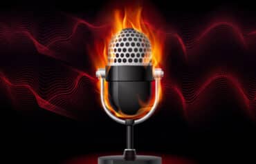 A glowing microphone surrounded by flames, illustrating the hot topic of legal ethics and podcasting.
