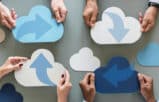 Hands holding paper cutouts of clouds with sync arrows, representing secure file sharing for lawyers.
