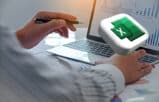 excel tips for legal professionals, man working on a laptop with spreadsheet charts